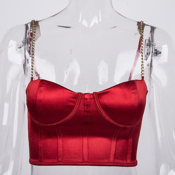 Red sexy corset crop top featuring a adjustable shoulder straps, back zipper closure and a low cut back. 