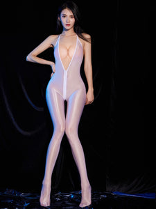 A woman posing in a sheer glossy white bodystocking with deep plunge halter neckline, front to back zipper closure and closed feet.