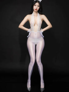 A woman posing in a white bodystocking featuring a floral lace halter front panel, with an attached glossy sheer pantyhose with an open crotch.