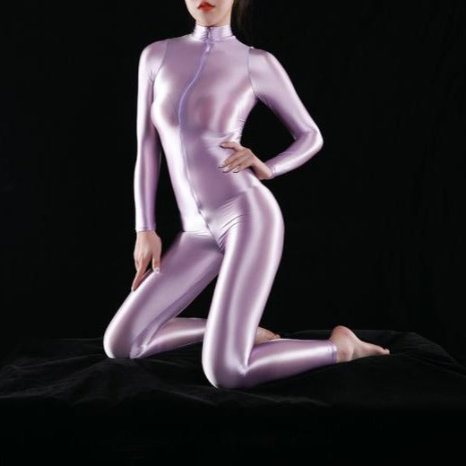 purple shiny bodysuit featuring a front zipper closure, long sleeves, and a high neckline. 