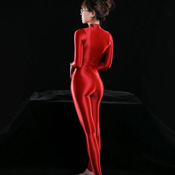 red shiny bodysuit featuring a front zipper closure, long sleeves, and a high neckline. 