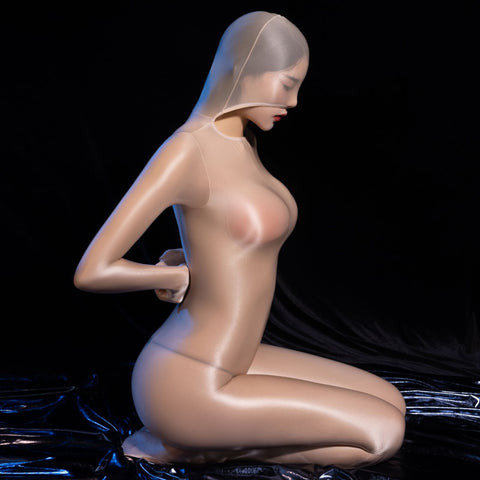 Lady wearing a beige glossy sheer long sleeves bodystocking with an open crotch, closed hand, and a pull over hood.