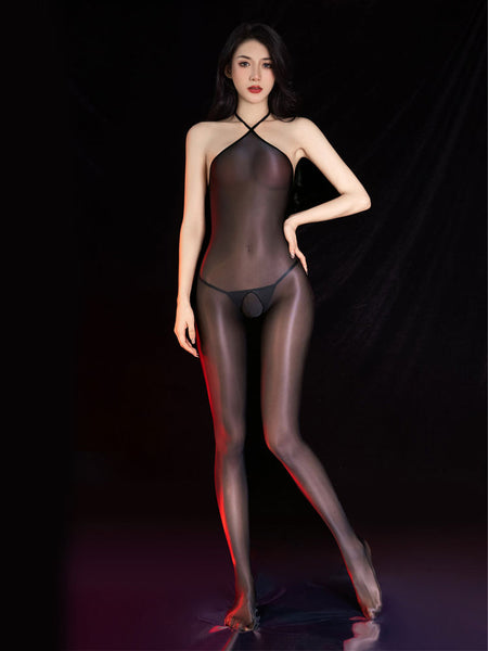 Front view of lady wearing a black sheer shiny bodystocking featuring a halter neck, closed feet and an open crotch.