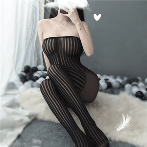 front view of lady wearing black bodystocking featuring a strapless neckline, striped bodice, striped attached stockings and an open crotch showing off her feet