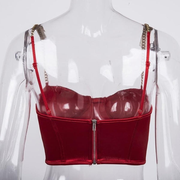 Red sexy corset crop top featuring a adjustable shoulder straps, back zipper closure and a low cut back. 