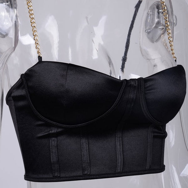 Black sexy corset crop top featuring a adjustable shoulder straps, back zipper closure and a low cut back. 