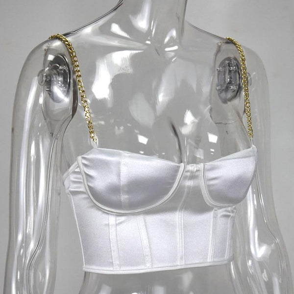 White sexy corset crop top featuring a adjustable shoulder straps, back zipper closure and a low cut back. 