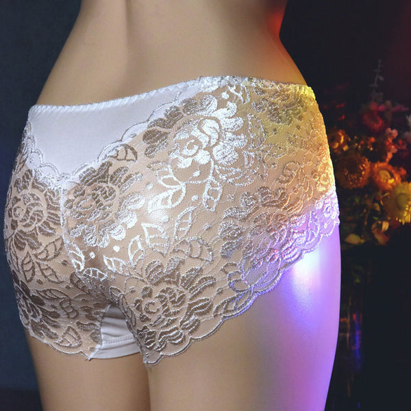 Back view of men's white sheer lace briefs.