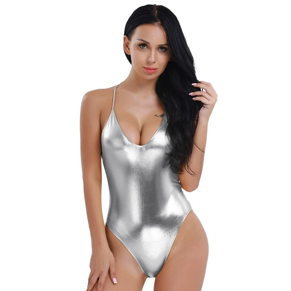 Silver bodysuit featuring a scoop neckline, spaghetti straps, high cut sides and a cheeky cut back. 