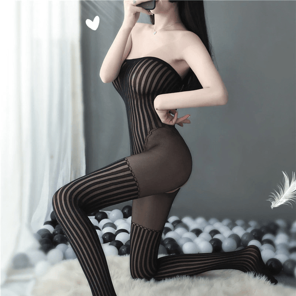 side view of lady wearing black bodystocking featuring a strapless neckline, striped bodice, striped attached stockings and an open crotch. 